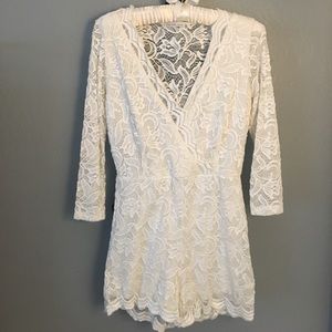 White/slightly cream floral/ tulip romper